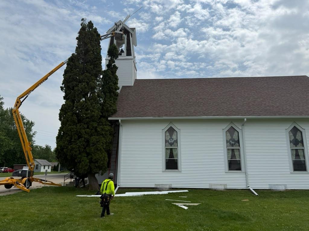 Church steeple and roofing work with lift